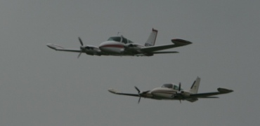 Rodney Swanson and Ben Dubois in a tight formation pass over Runway 20 at Juneau in 2008.